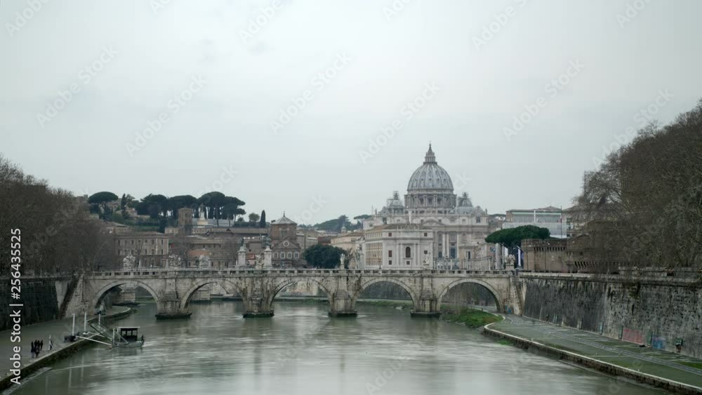 Day light time-lapse shot. of Rome, Vatican, St Peter Basilica and St Angelo Bridge crossing Tiber River in the city center of Rome Italy, historical landmarks of the Ancient Rome , travel destination Day light time-lapse shot. of Rome, Vatican, St Peter Basilica and St Angelo Bridge crossing Tiber River in the city center of Rome Italy, historical landmarks of the Ancient Rome , travel destination