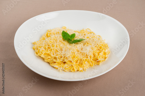 pasta with cheese in a white plate