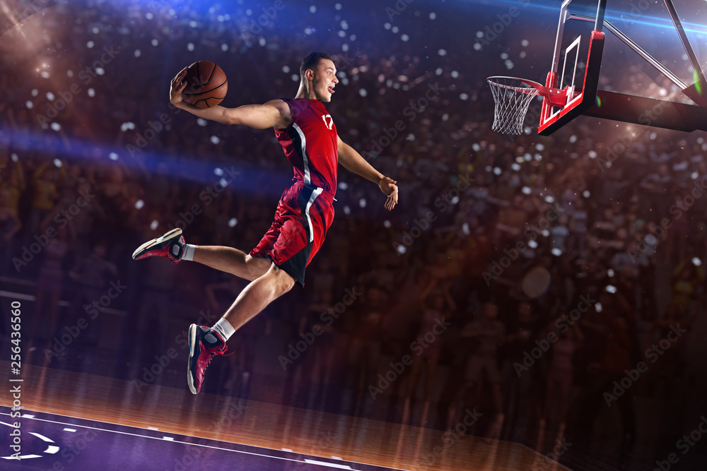 Basketball player in jump. around Arena with blue light spot