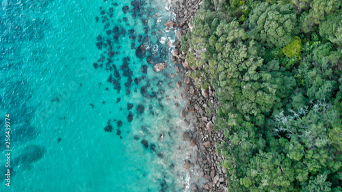 Cathedral Cove coastline at sunset. Amazing overhead aerial view from drone
