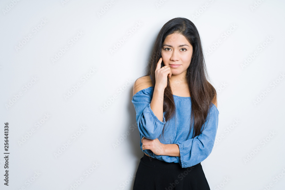 Beautiful brunette woman over isolated background thinking looking tired and bored with depression problems with crossed arms. Beautiful brunette woman over isolated background thinking looking tired and bored with depression problems with crossed arms.