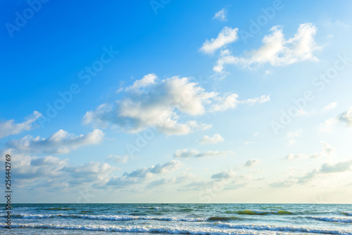 Fototapeta Naklejka Na Ścianę i Meble -  Beautiful early morning sunrise over the sea the horizon,blue sky background texture with white clouds sunset.