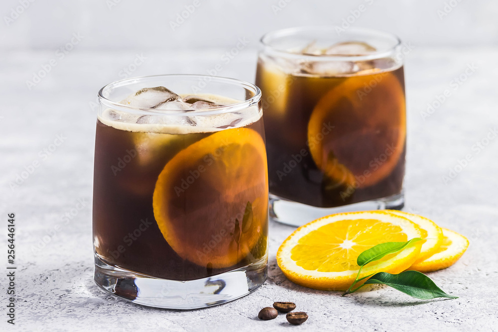 Orange spiced cold brew coffee. Selective focus, space for text. Orange spiced cold brew coffee. Selective focus, space for text.