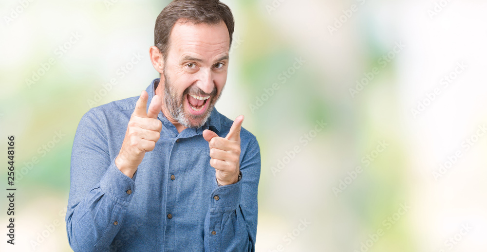 Handsome middle age elegant senior man over isolated background pointing fingers to camera with happy and funny face. Good energy and vibes. Handsome middle age elegant senior man over isolated background pointing fingers to camera with happy and funny face. Good energy and vibes.