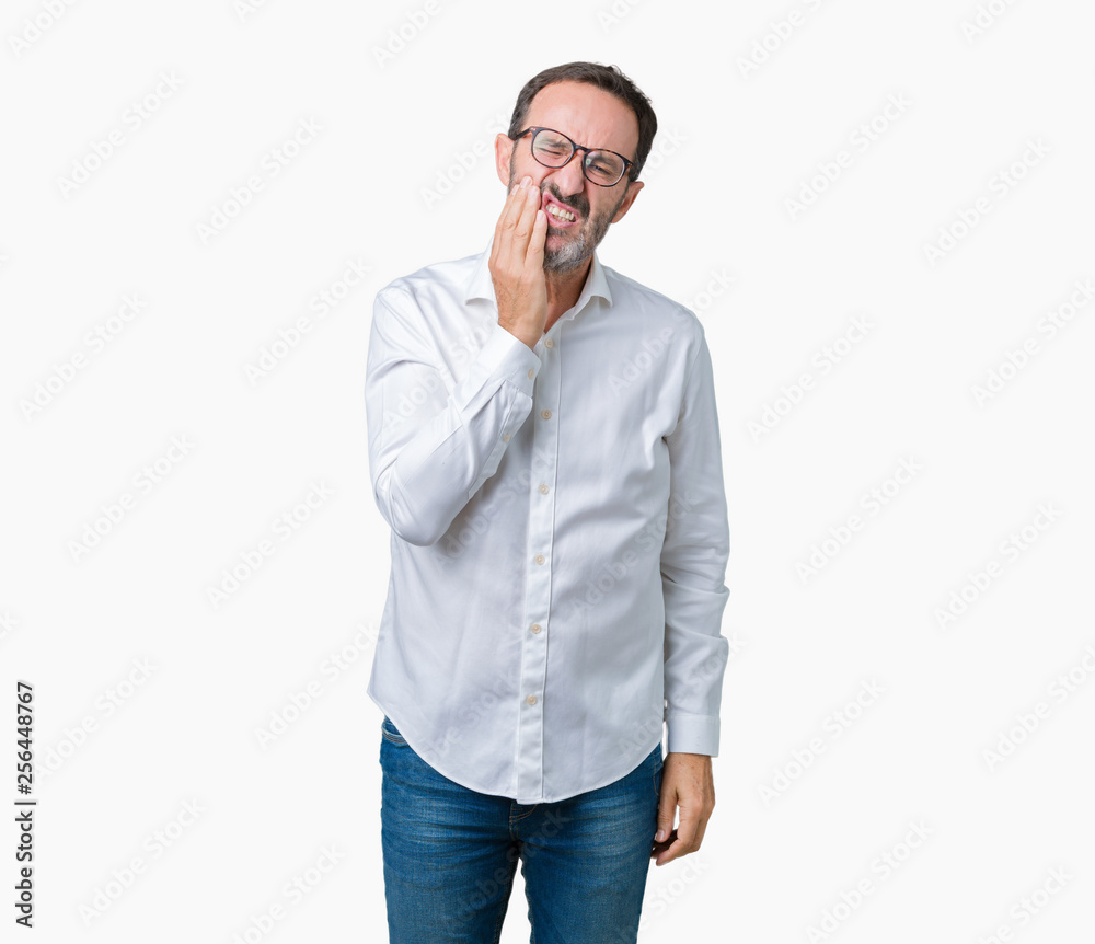 Handsome middle age elegant senior business man wearing glasses over isolated background touching mouth with hand with painful expression because of toothache or dental illness on teeth Handsome middle age elegant senior business man wearing glasses over isolated background touching mouth with hand with painful expression because of toothache or dental illness on teeth