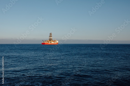 offshore oil and gas drillship  blue ocean background
