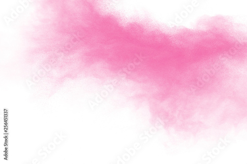 Bizarre forms of pink powder splatter on white background.