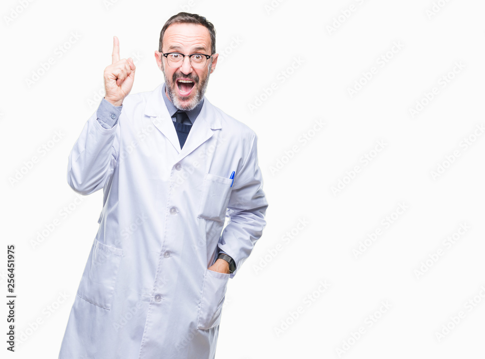 Middle age senior hoary professional man wearing white coat over isolated background pointing finger up with successful idea. Exited and happy. Number one. Middle age senior hoary professional man wearing white coat over isolated background pointing finger up with successful idea. Exited and happy. Number one.