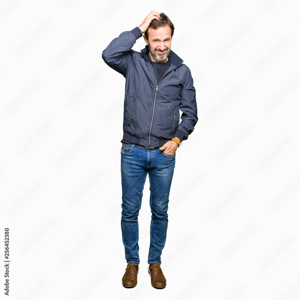 Middle age handsome man wearing a jacket confuse and wonder about question. Uncertain with doubt, thinking with hand on head. Pensive concept. Middle age handsome man wearing a jacket confuse and wonder about question. Uncertain with doubt, thinking with hand on head. Pensive concept.