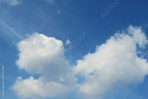 Fluffy clouds in blue sky, natural background