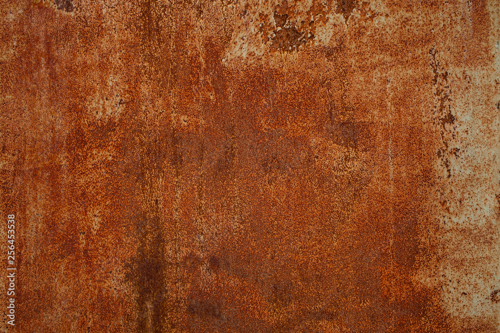 Rusty yellow-red textured metal surface. The texture of the metal sheet is prone to oxidation and corrosion. Textured Background in Grunge Style Rusty yellow-red textured metal surface. The texture of the metal sheet is prone to oxidation and corrosion. Textured Background in Grunge Style