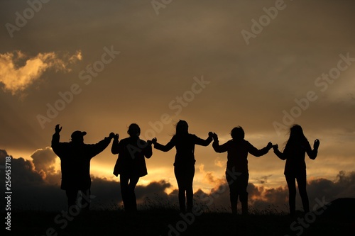 group of happy young people dancing at the beach on beautiful summer sunset .savsat/artvin/turkey © murat