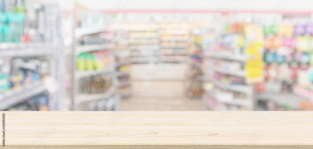 Empty Wood table top with supermarket grocery store blurred defocused background with bokeh light for montage product display