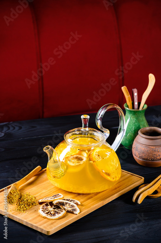 ginger tea with orange in a glass teapot