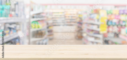 Empty Wood table top with supermarket grocery store blurred defocused background with bokeh light for montage product display