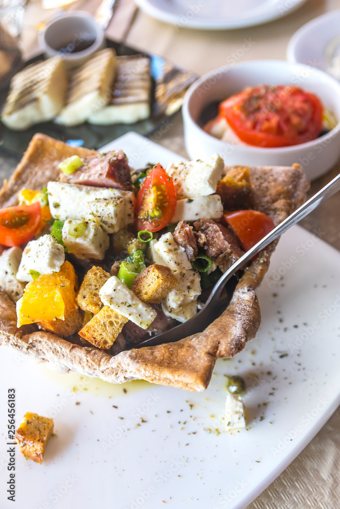 Mediteranean orange and cheese salad in a bread made pot Mediteranean orange and cheese salad in a bread made pot