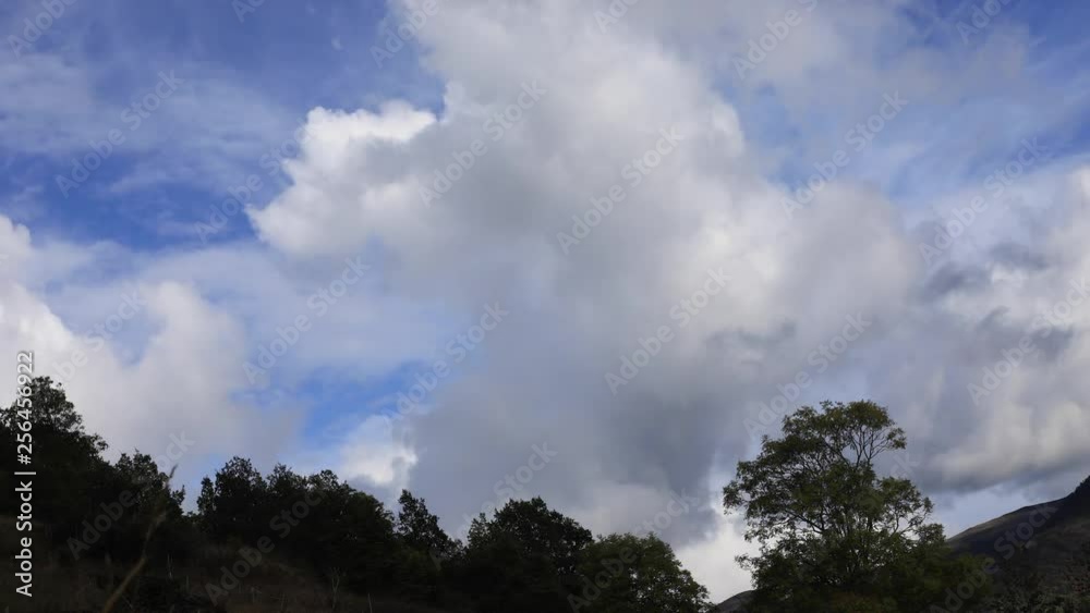 Timelapse of moving clouds and forest, Occitanie in the southern of France Timelapse of moving clouds and forest, Occitanie in the southern of France