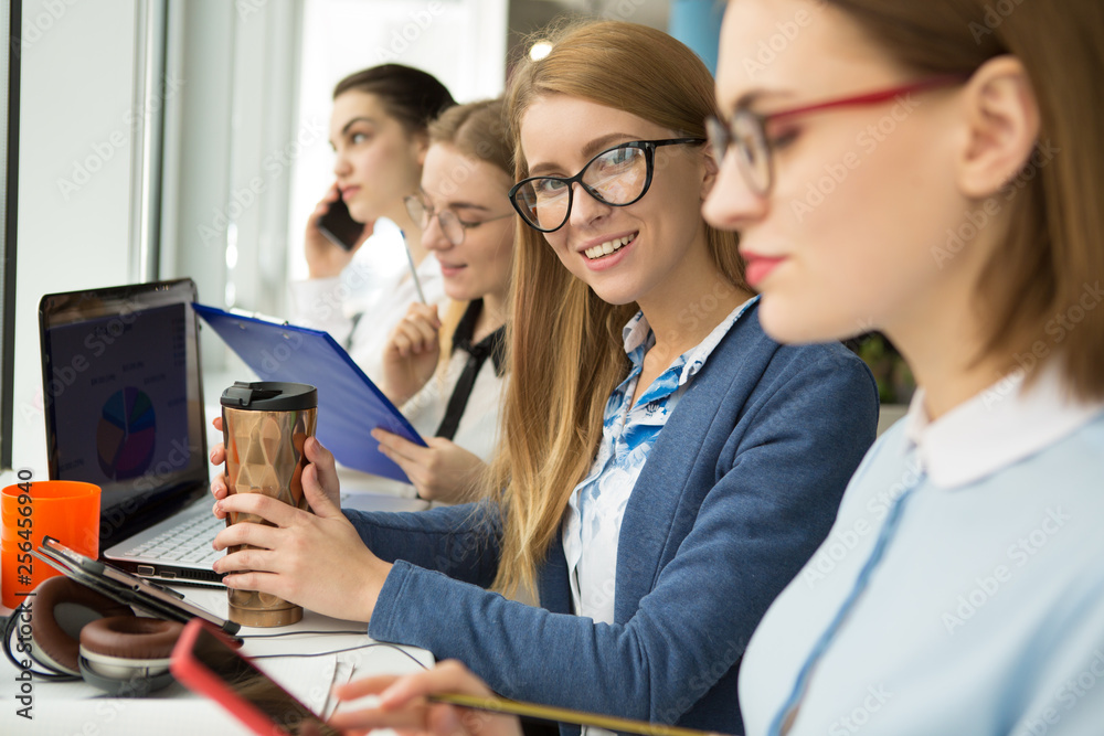 Group of young businesswomen working together Group of young businesswomen working together