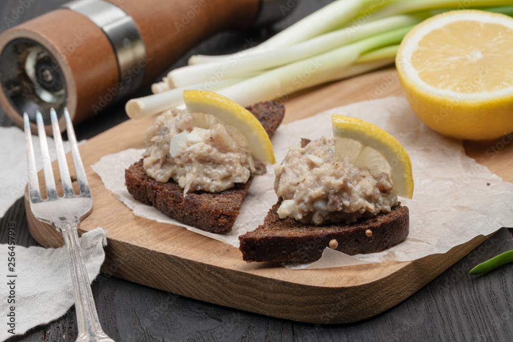 minced herring fillet with apple and egg on toasted rye bread, homemade traditional Jewish cuisine dish forshmak, snack or appetizer minced herring fillet with apple and egg on toasted rye bread, homemade traditional Jewish cuisine dish forshmak, snack or appetizer