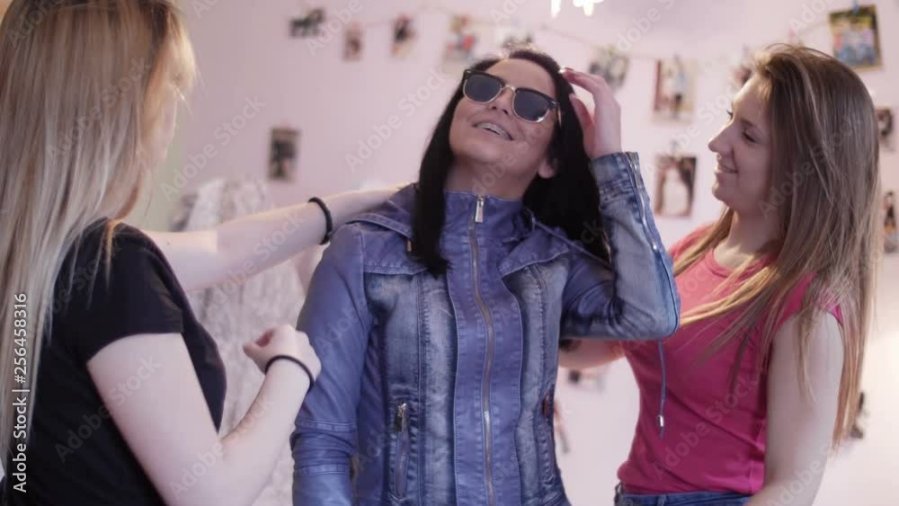 Teenage girlfriends deciding what to put on Teenage girlfriends deciding what to put on