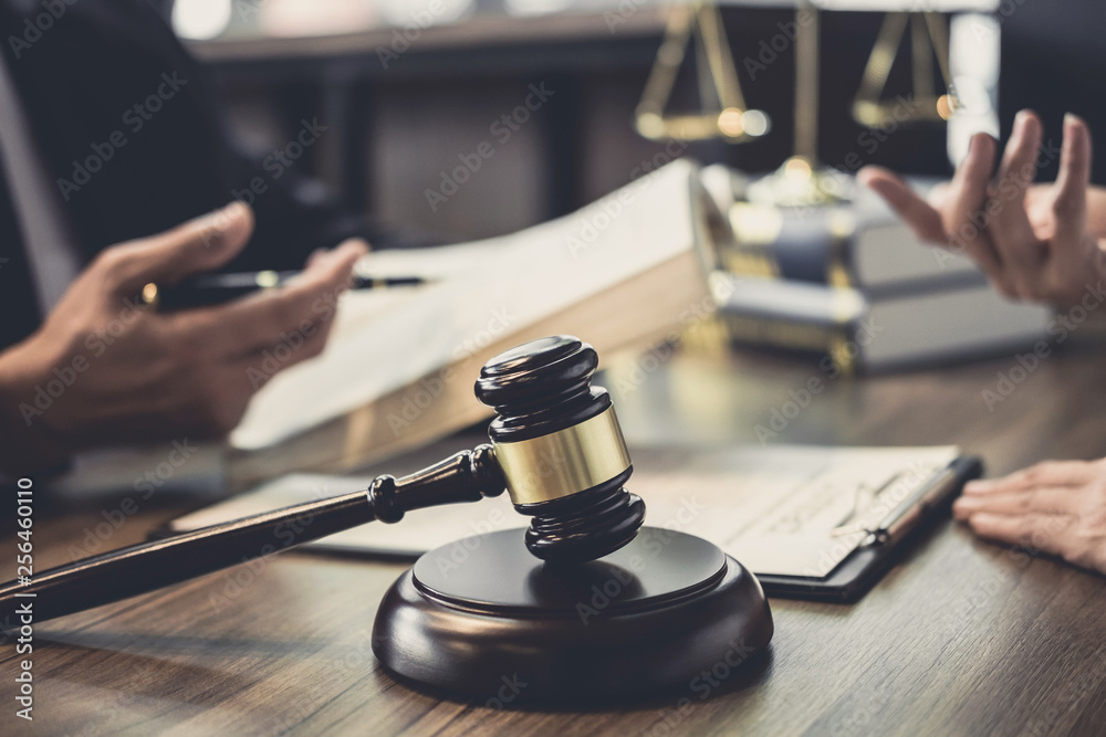 Businesswoman and Male lawyer or judge consult having team meeting with client, Law and Legal services concept Businesswoman and Male lawyer or judge consult having team meeting with client, Law and Legal services concept
