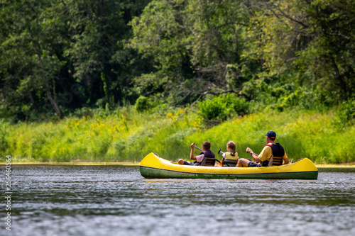 Family in boat trip by boat on the river.