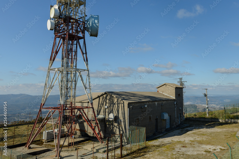 cellular antennas against a blue sky