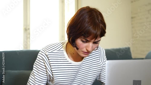 Worried woman buying online worried having problems paying with credit card. In Internet shopping addiction and online banking.