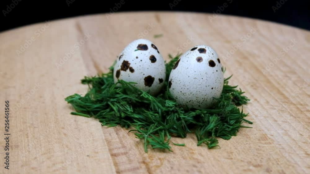 two quail eggs lying in a salad slowly rotate in front of the camera two quail eggs lying in a salad slowly rotate in front of the camera