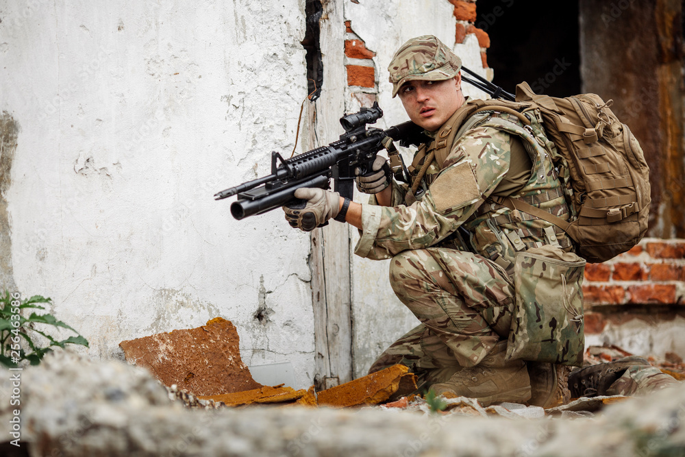 Fototapeta premium Portrait soldier or private military contractor holding sniper rifle.