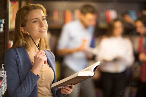 Beautiful young woman at the library photo