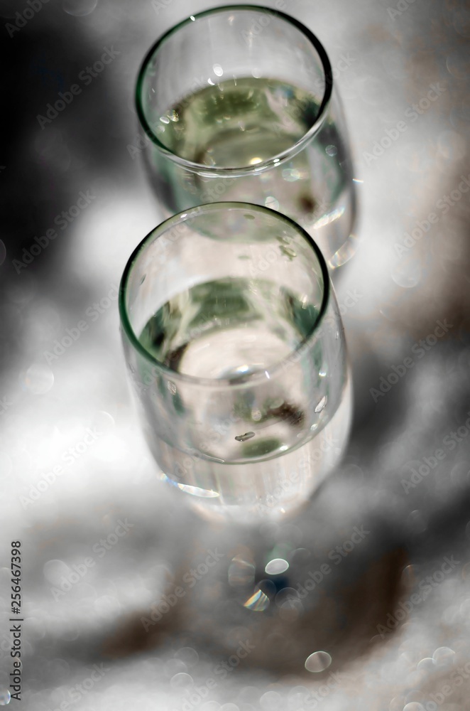 glass of water with ice on a black background