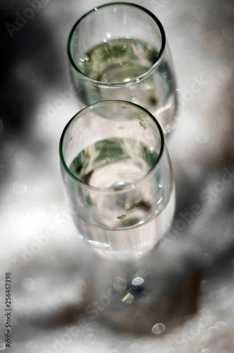 glass of water with ice on a black background