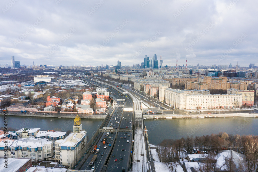 panorama high-rise buildings and transport of metropolis, Frunzenskaya Embankment and the Third Transport Ring, cars on multi-lane highways and road junction in Moscow.