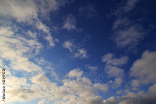 Clouds after rain before sunset as a background