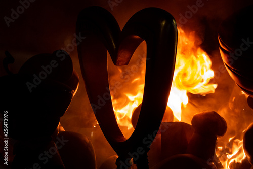 Burning of Valencian falla at night with heart ninot photo