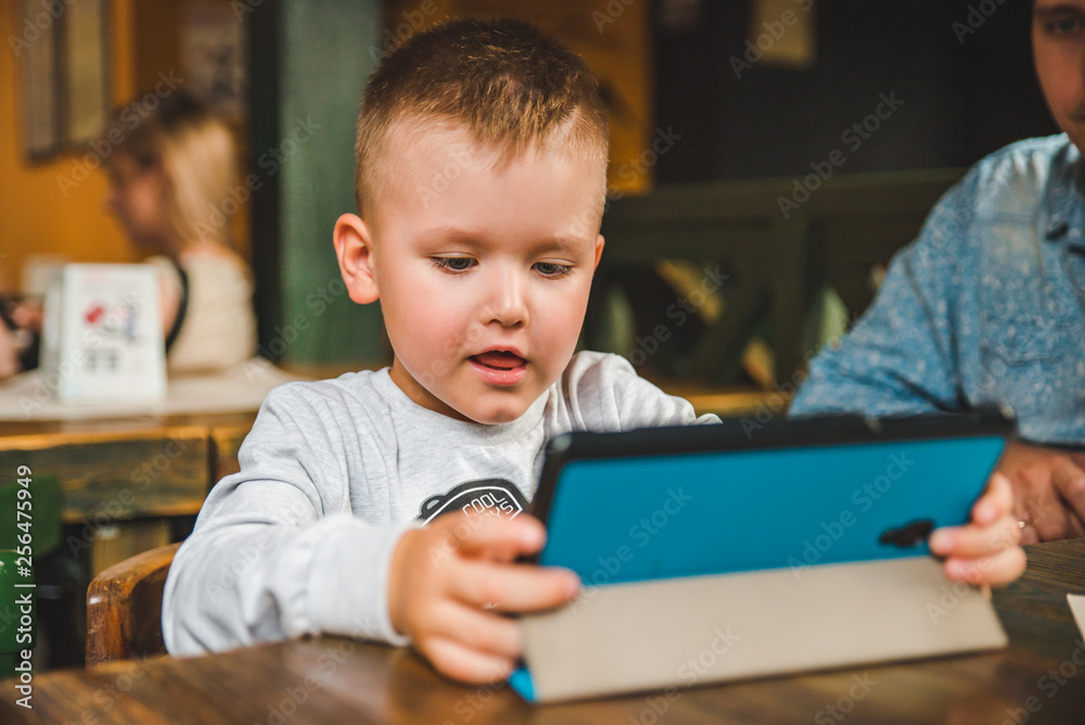 little boy sitting with tablet little boy sitting with tablet
