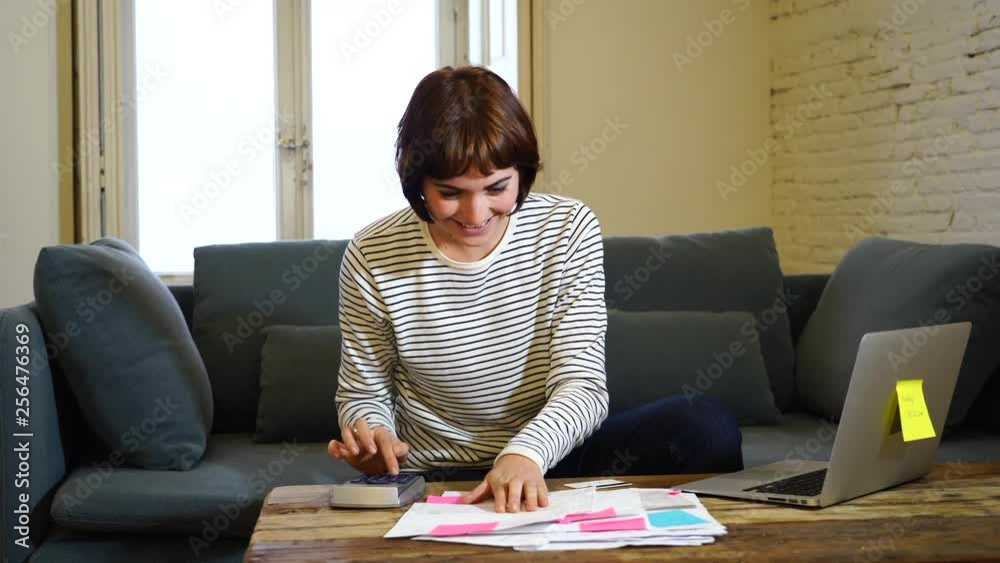 Happy woman with laptop feeling successful accounting home finances calculating costs, charges, mortgage, taxes and paying bills. In e-banking, e-commerce and home or small business accountant. Happy woman with laptop feeling successful accounting home finances calculating costs, charges, mortgage, taxes and paying bills. In e-banking, e-commerce and home or small business accountant.