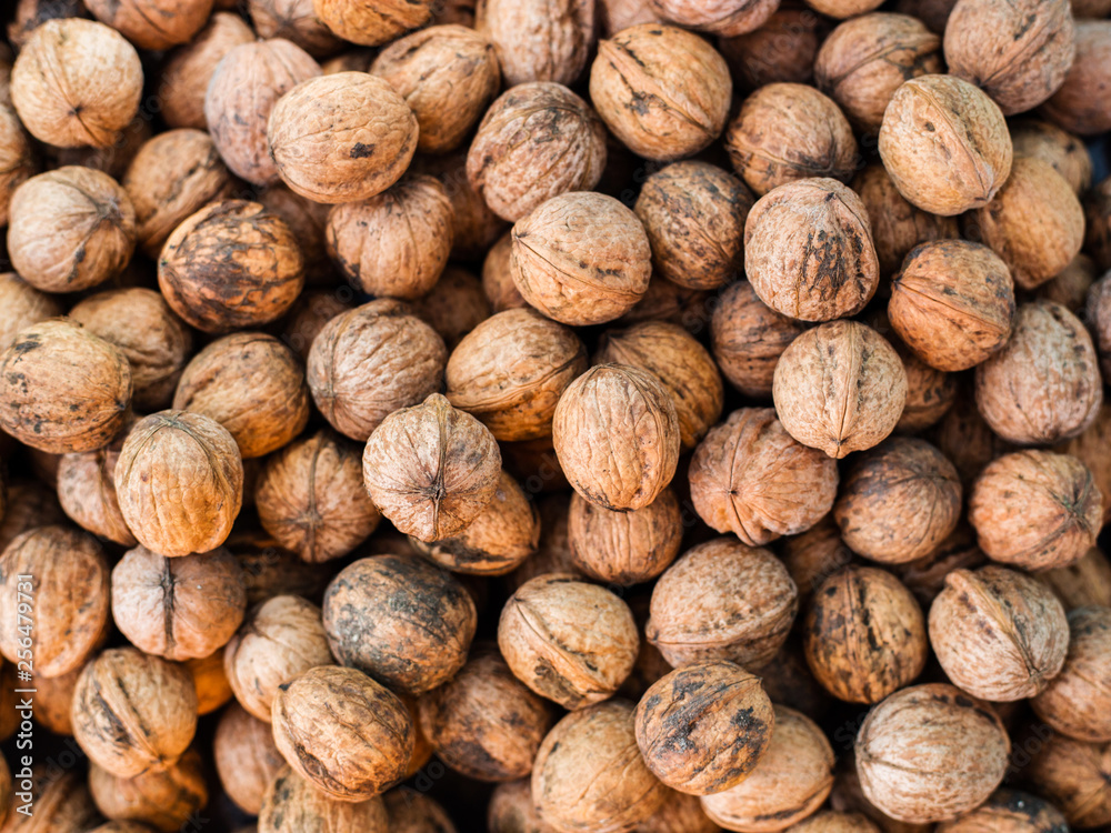 Natural walnut pattern texture, Raw bio walnuts background Natural walnut pattern texture, Raw bio walnuts background