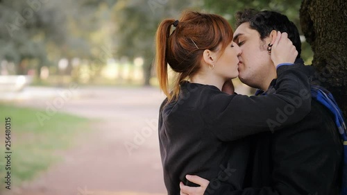 betrayal, infidelity. Young woman sees her boyfriend kissing another woman