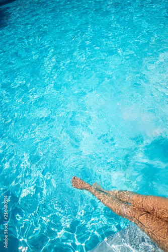 Female legs in the pool water. Up view © Михаил Решетников