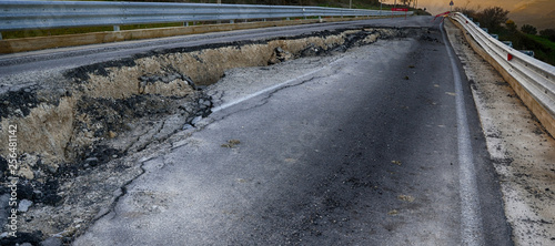 Asphalt road destroyed by the landslide 