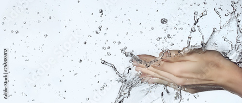 woman hand in water splash photo