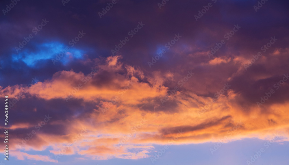 Evening sky at sunset. Dark dramatic clouds during the sunset_