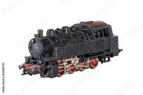 Locomotive isolated. Vintage model of an electric toy steam train isolated on a white background. Decorations background.