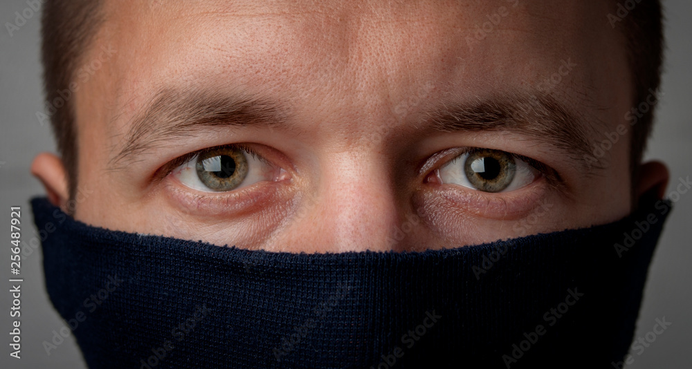 Man's face covered with a mask Man's face covered with a mask