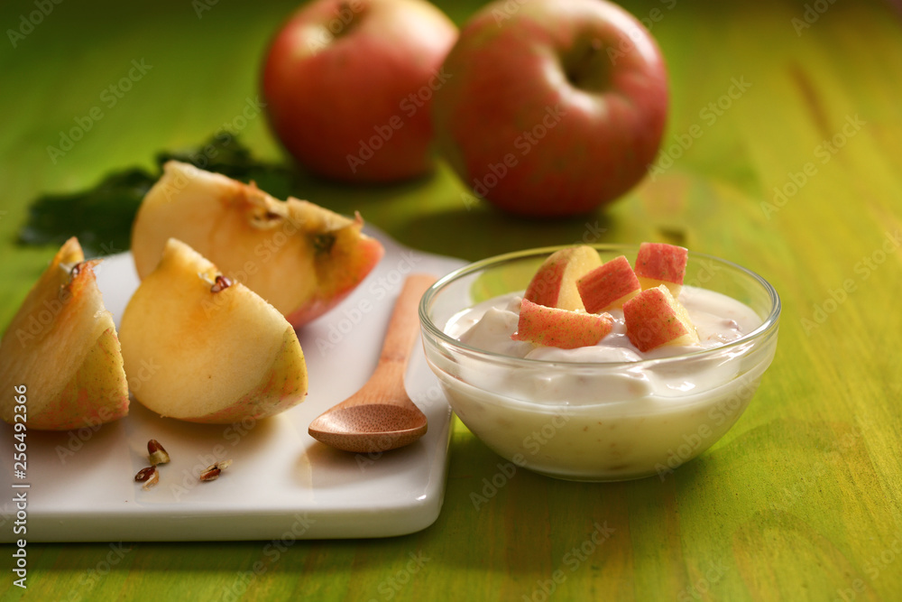 apple yogurt in the glass bowl with fruit around - closeup apple yogurt in the glass bowl with fruit around - closeup