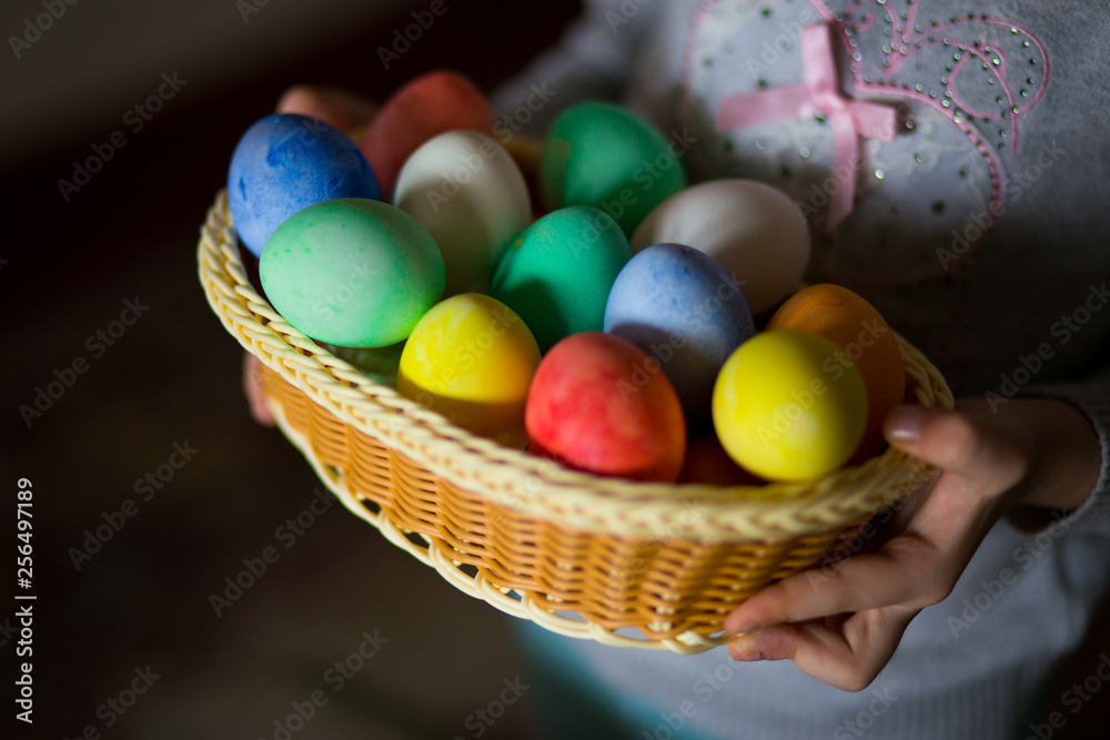 Cute little girl with bunny ears holding bright Easter egg Cute little girl with bunny ears holding bright Easter egg