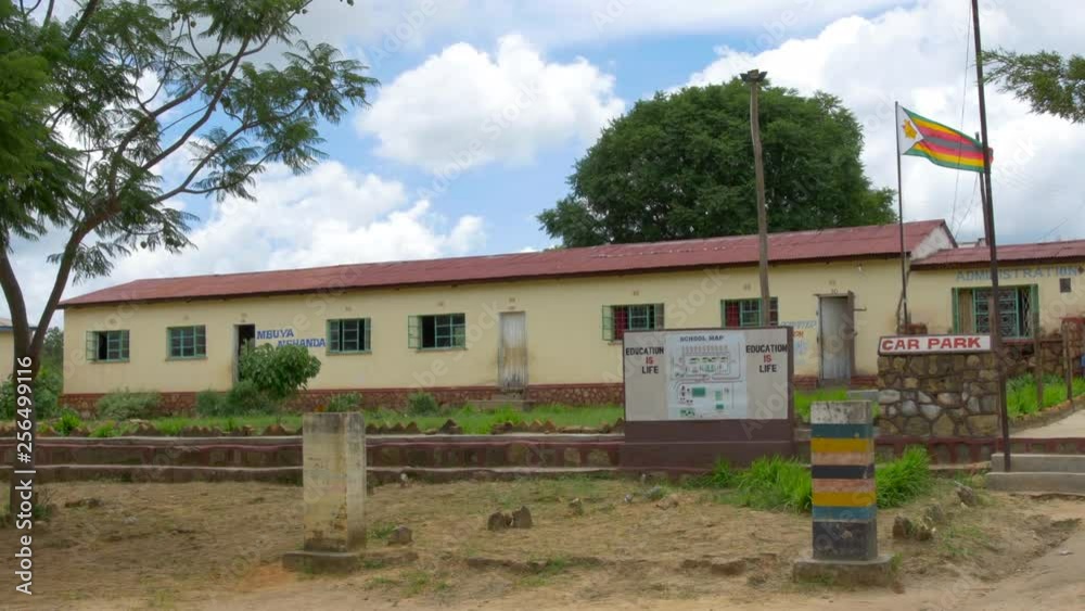Wide Shot of the Main Building at a Primary School in Rural Zimbabwe, Africa on a Beautiful Sunny Day Wide Shot of the Main Building at a Primary School in Rural Zimbabwe, Africa on a Beautiful Sunny Day