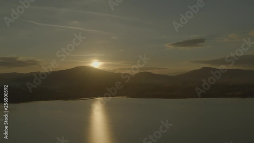 Wallpaper Mural Aerial drone shot of boat floating on huge lake at sunset in summer  Torontodigital.ca